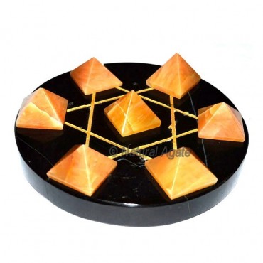 7 Golden Quartz Pyramids with Black Agate Base