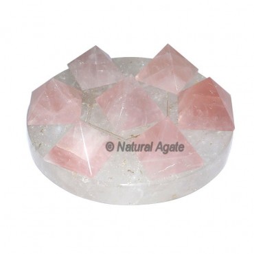 7 rose Quartz Pyramids with Crystal David Star Bas