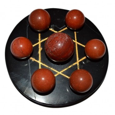 7 Red Jasper Ball with Black Gold David Star Base